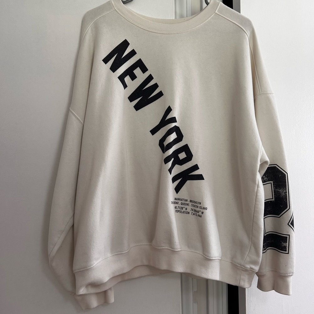 Cream Crewneck Sweater with Bold New York Graphic